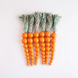 Handcrafted Easter carrot wood bead garland set with rustic jute tassels and farmhouse style