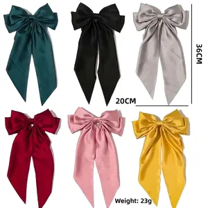 Oversized satin bow hair clip with long ribbons in six vibrant colors, 36cm length