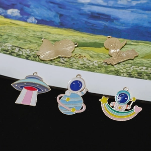 Space-themed enamel UFO and astronaut charms with golden plating for DIY jewelry