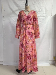 Detail of floral chiffon maxi dress with lantern sleeves and gathered waist design
