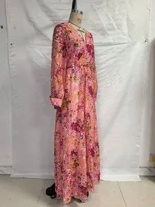 Detail of pink floral print chiffon dress showing V-neckline and elegant waist design