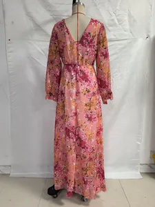 Macro detail of the deep V-back design and floral pattern on the summer maxi dress