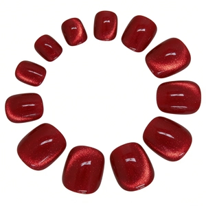 Detailed view of 12pcs dark red cat-eye effect press-on toenails with metallic glitter