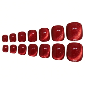 Deep red cat eye press-on toenails set featuring 14 pieces with shimmering magnetic finish