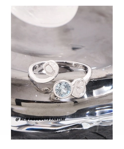 Detailed macro view of S925 silver ring featuring a blue zircon and rose flower design