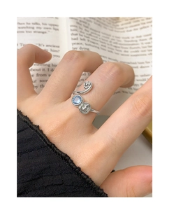 Detailed close-up of S925 silver ring with blue zircon and vintage floral relief