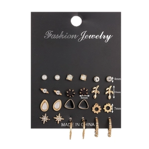 Set of 12 pairs of vintage gold earrings with crystal stars and geometric shapes