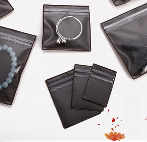 Detail of wood grain PVC jewelry bags with transparent window and resealable seal