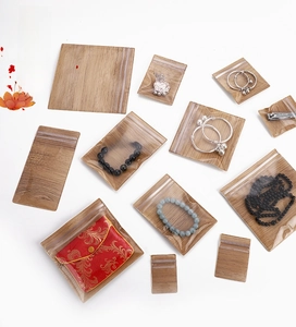 Detail of light wood grain PE storage bags for jewelry in multiple sizes