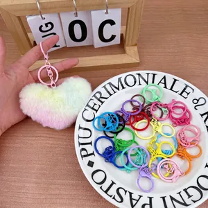 Plush heart keychains in rainbow gradient colors with assorted metal hooks