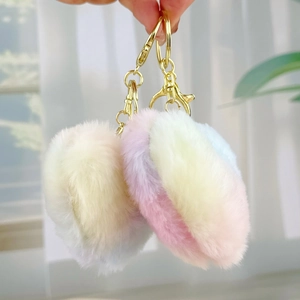 Detail of colorful macaron plush heart keychain with gold metal lobster clasp and ring