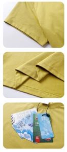 Detail of yellow Sorona cooling T-shirt showing sleeve cuffs and technical fabric labels