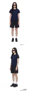 Detail view of HEIQ cooling dark blue crewneck T-shirt paired with casual black shorts