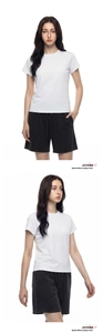 Detailed view of casual white crewneck t-shirt and black drawstring shorts on a model
