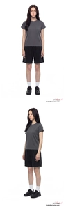 Detail view of dark grey crewneck T-shirt and black shorts in a minimalist sporty style