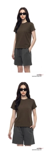 Detail view of a brown crewneck T-shirt and grey drawstring shorts on a model