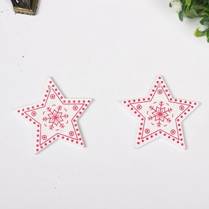 Pair of star-shaped wooden Christmas ornaments with red snowflake patterns and top hanging holes