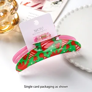 Christmas themed large hair claw clip with festive red hat design and pink inner finish