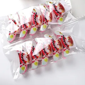 10-piece pack of large acrylic Christmas hair claws with Santa patterns in festive colors