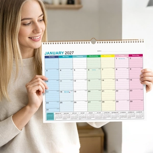 Close-up of 2027 January monthly wall calendar with spiral binding and US holidays