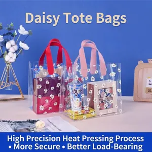 Transparent PVC tote gift bag with white daisy print and durable ribbon handles