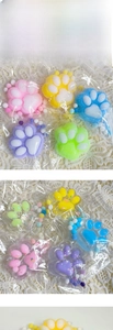 Close-up of colorful plush and glitter resin cat paw charms on white lace background