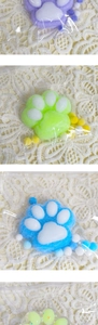 Detail of colorful plush cat paw squishy toys in individual transparent packaging