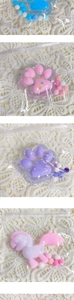 Detail of resin cat paw and pony DIY charms with glitter and soft plush balls