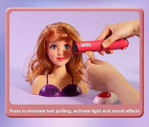Detail of doll head with hair straightener toy showing interactive sound and light features