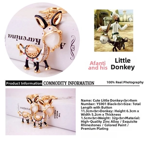 Detail view of cartoon donkey keychain with sparkling rhinestones and enamel finish