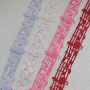 Detailed macro view of music note lace ribbons in white, purple, pink and red colors