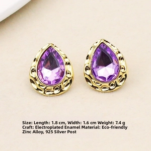Macro detail of teardrop enamel earrings with purple gems and 925 silver posts