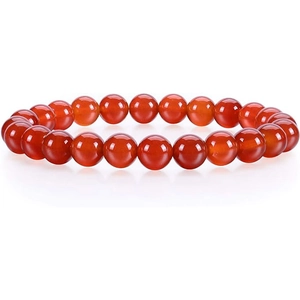 Detail of red agate bead bracelet with polished 10mm round semi-transparent stones