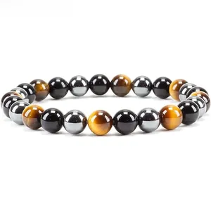 Detailed view of elastic bracelet with tiger eye, obsidian, and hematite round beads