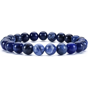 Detailed close-up of dark blue natural stone beads with white marble textures on a round bracelet