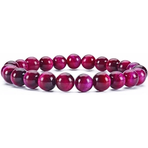 Detailed view of polished fuchsia tiger eye beads with natural chatoyant texture and silk luster