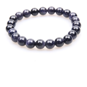 Detailed view of blue sandstone beads bracelet featuring a glittering starry sky effect
