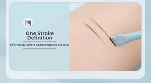 Close-up of angled eyeliner brush creating precise fine lines for detailed eye makeup