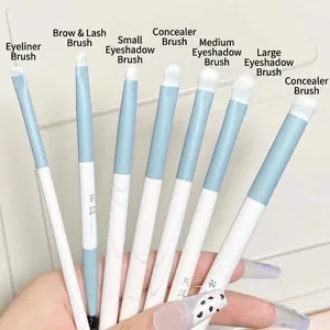 Blue and white 7-piece eye makeup brush set with soft white synthetic fibers and silver ferrule