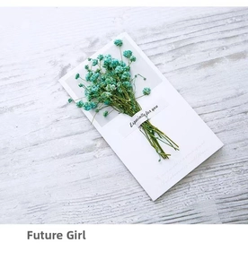 Close-up of blue dried gypsophila flowers on greeting card with 'Especially for you' text
