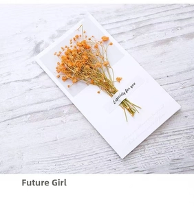 Close-up of dried gypsophila flower bouquet on a white card for special gift greetings