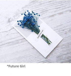 Detail of blue dried flowers on Especially For You gift card over white wooden background