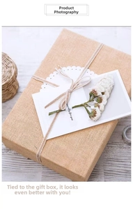 Detail of linen gift box with white dried flowers and Especially for you greeting card