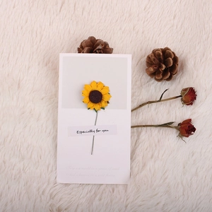 Detail of 3D sunflower greeting card with 'Especially for you' text on plush background