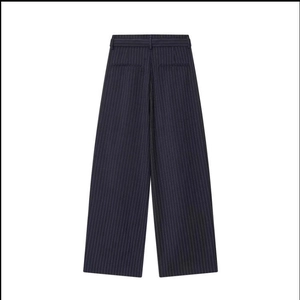 Detail of navy blue striped wide-leg trousers with back pockets and smooth suit fabric