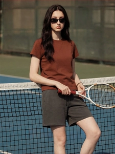 Detail of breathable brown sports T-shirt featuring rapid cooling and moisture-wicking technology