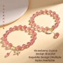 Detailed macro view of natural strawberry quartz beaded bracelets with gold butterfly charms