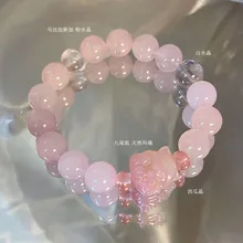 Pink quartz and watermelon crystal bracelet featuring a carved natural agate fox charm