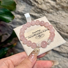 Detail of pink crystal bead bracelet with freshwater pearls and silver spacers
