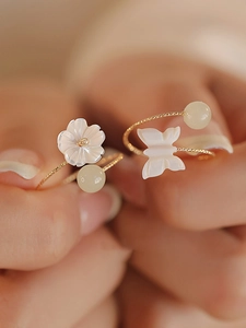 Elegant gold open rings featuring white shell flower and butterfly motifs with round beads